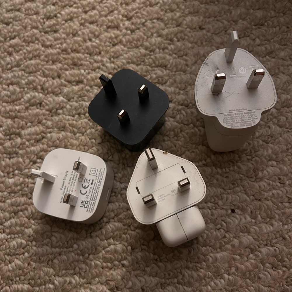Set of Four UK Plug Adapters in Black and White